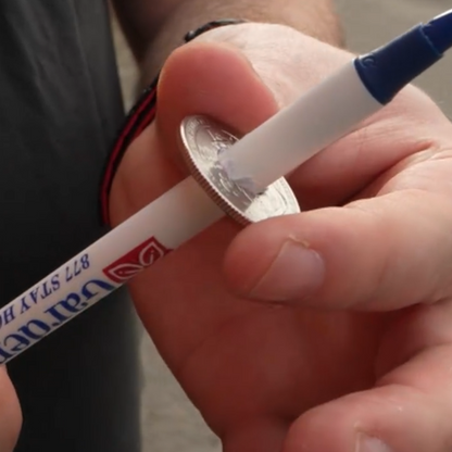 Pen Through Coin by Michael Ammar
